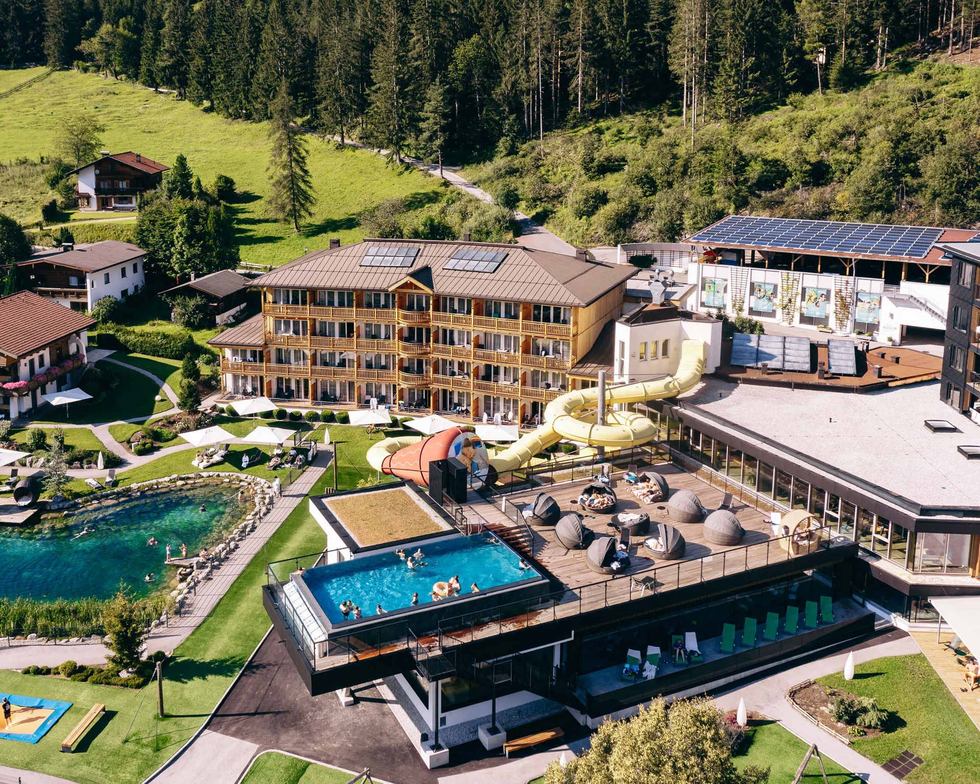 Welcome to our family hotel at Lake Achensee. Resort with outdoor pool, water slide, and natural swimming pond in the mountains
